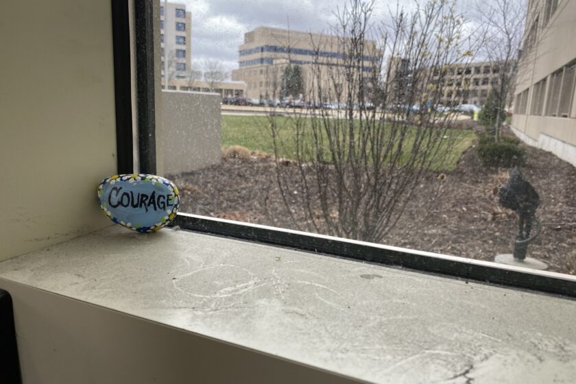 Encouragement Rock Left By Anonymous2 A rock painted with the word "courage" in a window