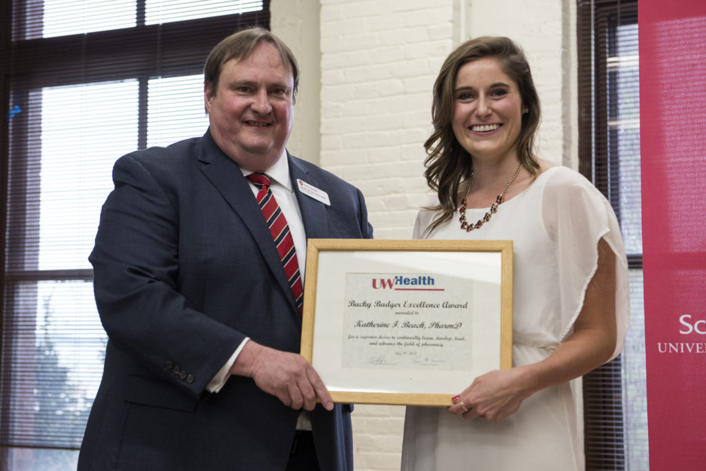 Graduation Awards Celebration_May 2018_DSC1974 Steve Swanson and Katherine Beach holding award