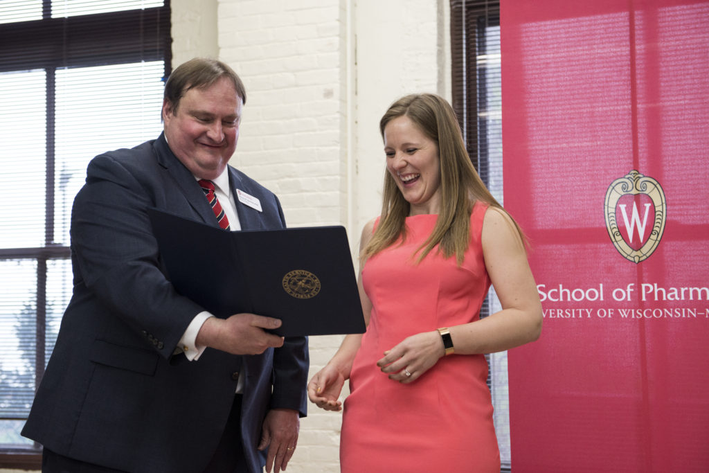 Graduation Awards Celebration_May 2018_DSC2234 Steve Swanson displaying award to Alicia Ritscher