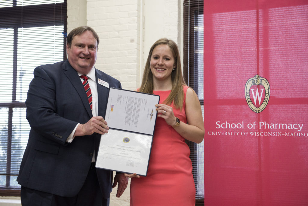 Graduation Awards Celebration_May 2018_DSC2245 Steve Swanson and Alicia Ritscher holding her award