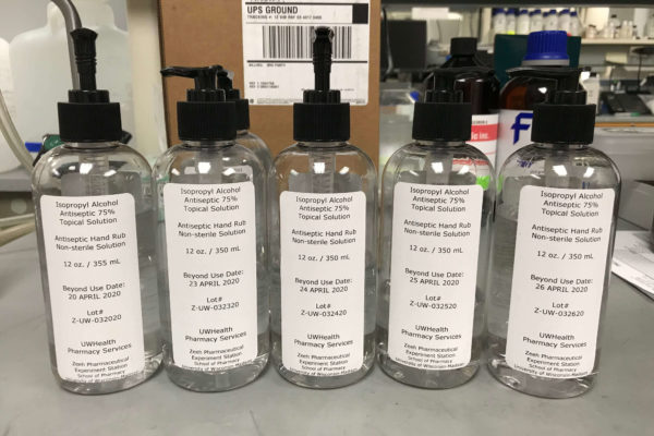 HandSanitizer-Week1 (1) Line-up of hand sanitizer bottles in a lab