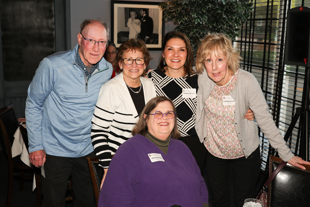 Angela de Ianni, Kathleen Connor, and others smile for a photo
