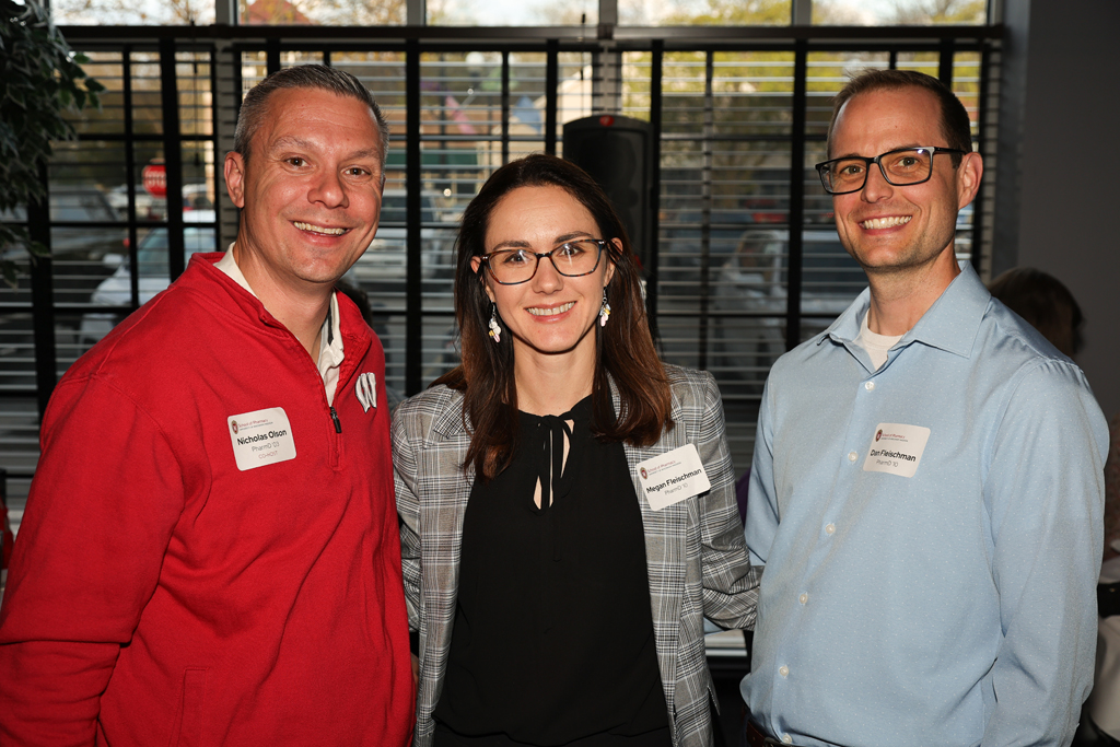 Nick Olson, Dan Fleischman, and Megan Fleischman pose for a photo