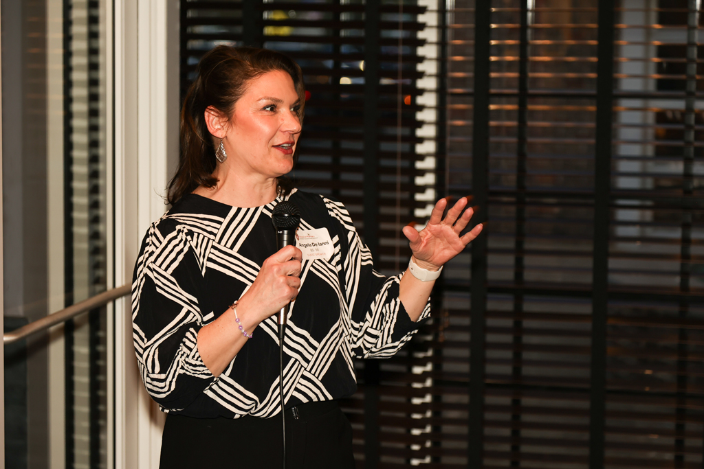 Angela de Ianni speaks with the microphone