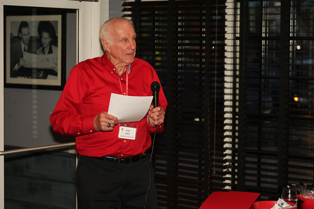 Tom Kies speaks with the microphone