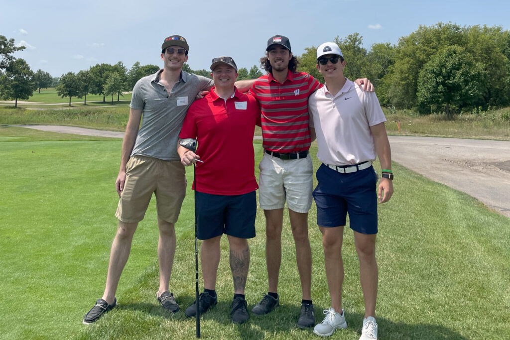IMG_4318 Students with alumni at a golf course
