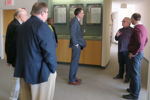 IMG_8447 Provost Karl Scholz listening to Jeff Johnson speaking with numerous SoP staff gathered also listening