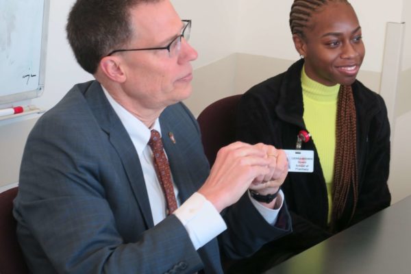 IMG_8494 Provost Karl Scholz and Cierra Brewer sitting at a table