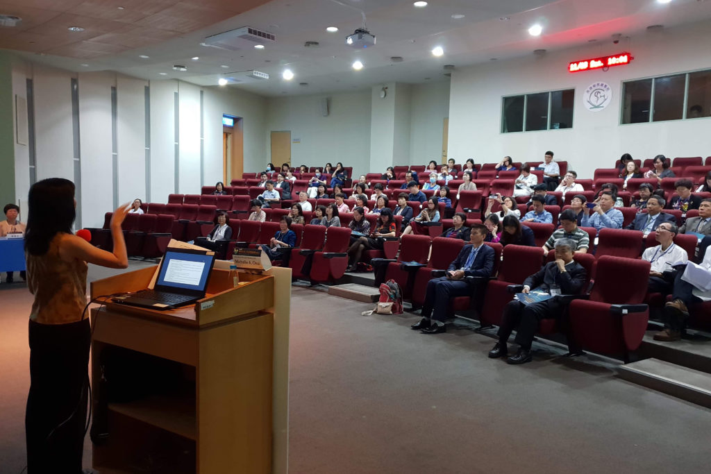 IMG_9136 Michelle Chui in Taiwan speaking at China Medical University and Taipei Medical University speaking at podium