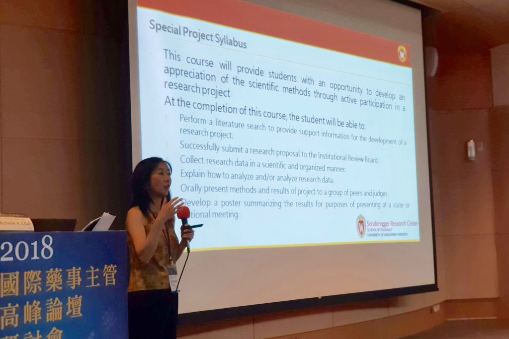 IMG_9137 Michelle Chui in Taiwan speaking at China Medical University and Taipei Medical University speaking at podium