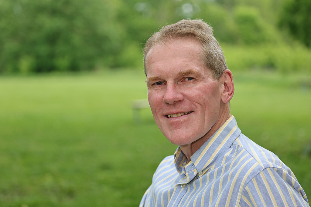 Jim Steffen in front of a green lawn