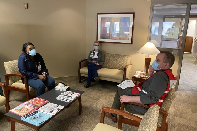 Meeting of the Minds Colleagues discussing in a waiting room.