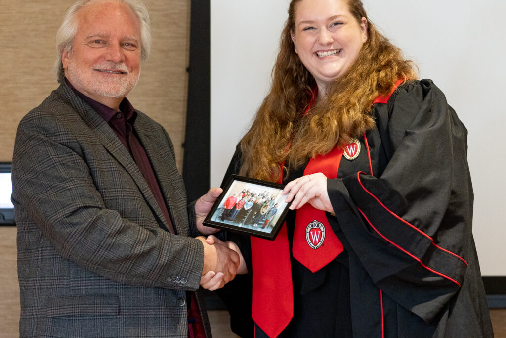 Jeff Johnson and a PharmTox graduate pose for a photo.