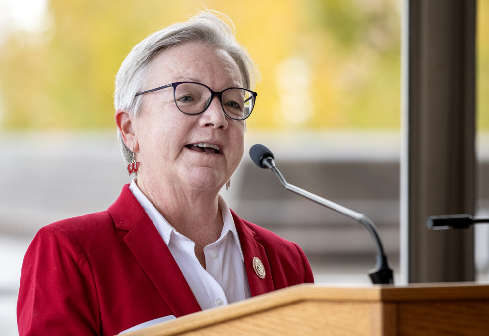 Jeanette Roberts speaking at a lectern