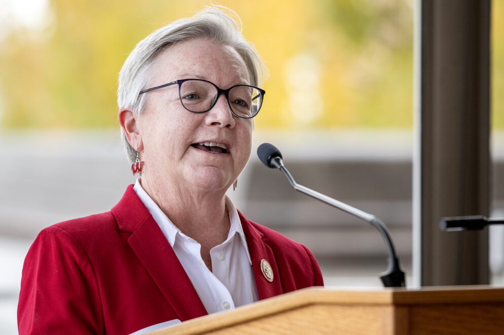 Jeanette Roberts speaking into microphone at podium