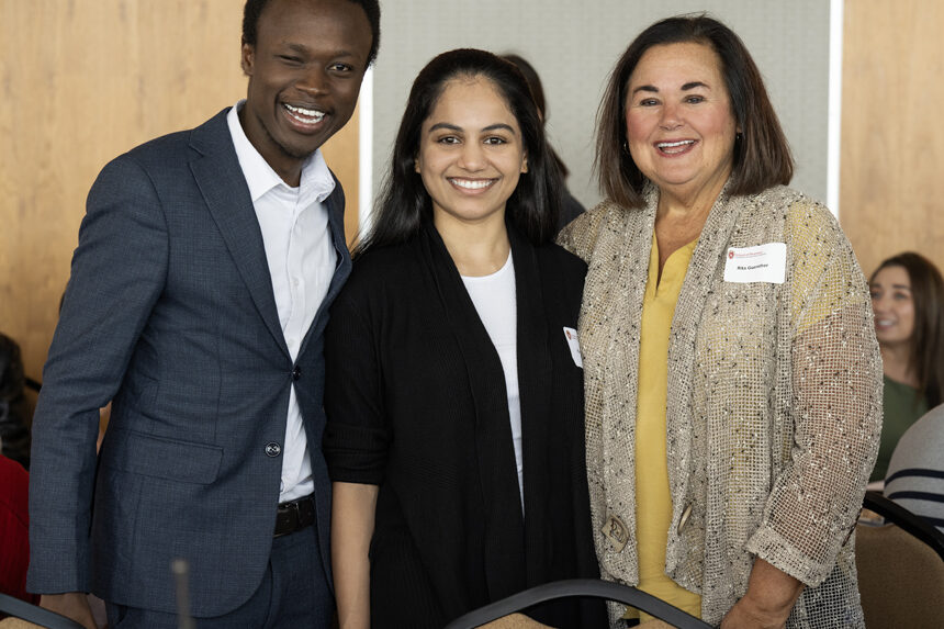 Vincent Elijah smiling for photo with Ruchita Patel and Rita Guenther