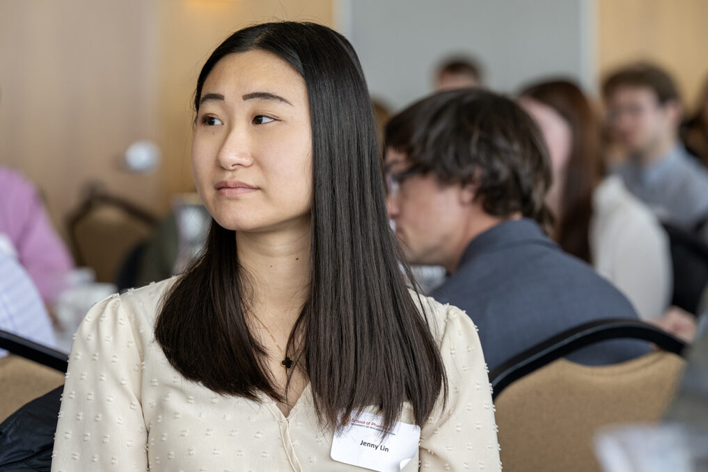Camera focused on Jenny Lin listening with attentive face to speaker