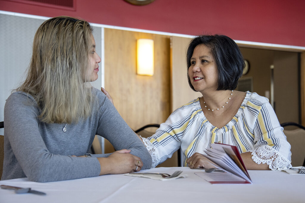 PharmD Student Scholarship Brunch_042021_BGI_5922 Ally Mahinay, a first-year PharmD student talks with her mother, Liza Mahinay, during the 2022 School of Pharmacy Scholarship Brunch