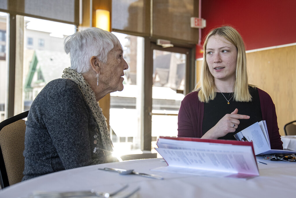 PharmD Student Scholarship Brunch_042021_BGI_6070 PharmD student Stacy Soltis (right) listens to her great Aunt Liz Allen while attending the 2022 School of Pharmacy Scholarship Brunch