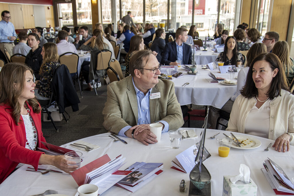 PharmD Student Scholarship Brunch_042021_BGI_6242 Dean Steve Swanson chats with Professor Andrea Porter and Julie Jensen, Director of Development at the School of Pharmacy, during the 2022 School of Pharmacy Scholarship Brunch at the Pyle Center