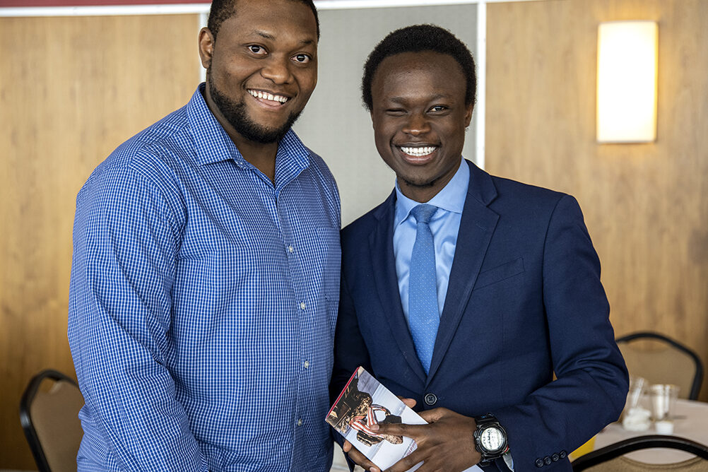 PharmD Student Scholarship Brunch_042021_BGI_6713 Second-year PharmD students Michael Nome and Vincent Elijah pose for a photo op during the School of Pharmacy Scholarship Brunch on Sunday, April 10, 2022.