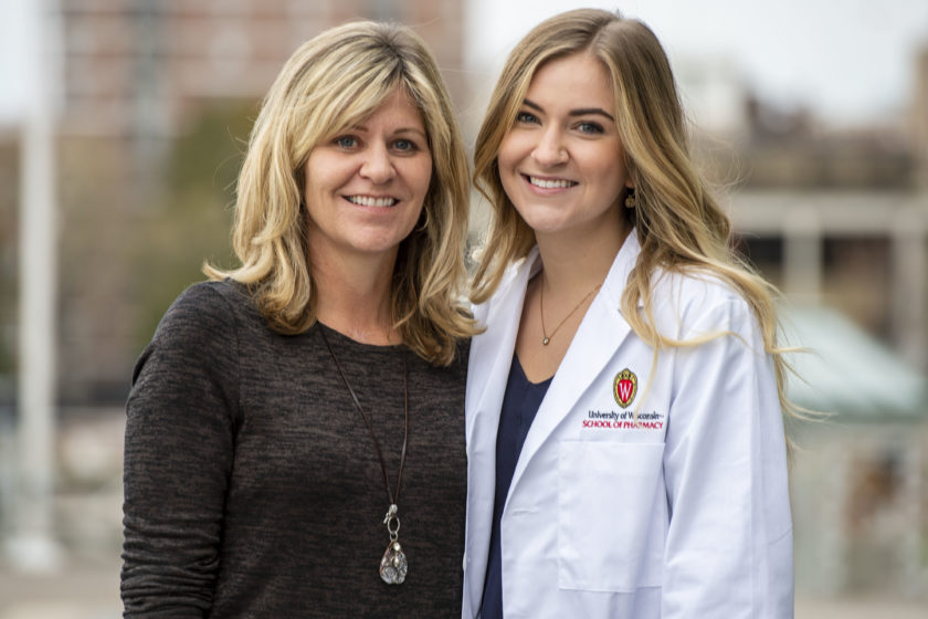 Student in white coat with their mother after white coat ceremony