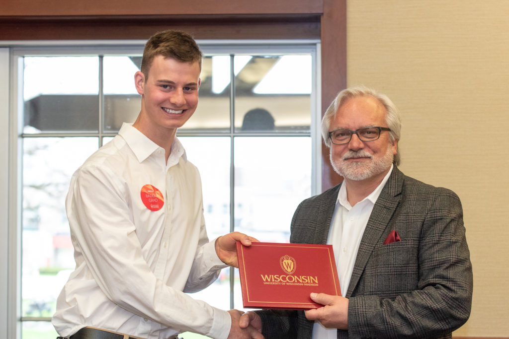 PharmToxCommence-05112019-057 Students receive their diploma from Professor Jeff Johnson.