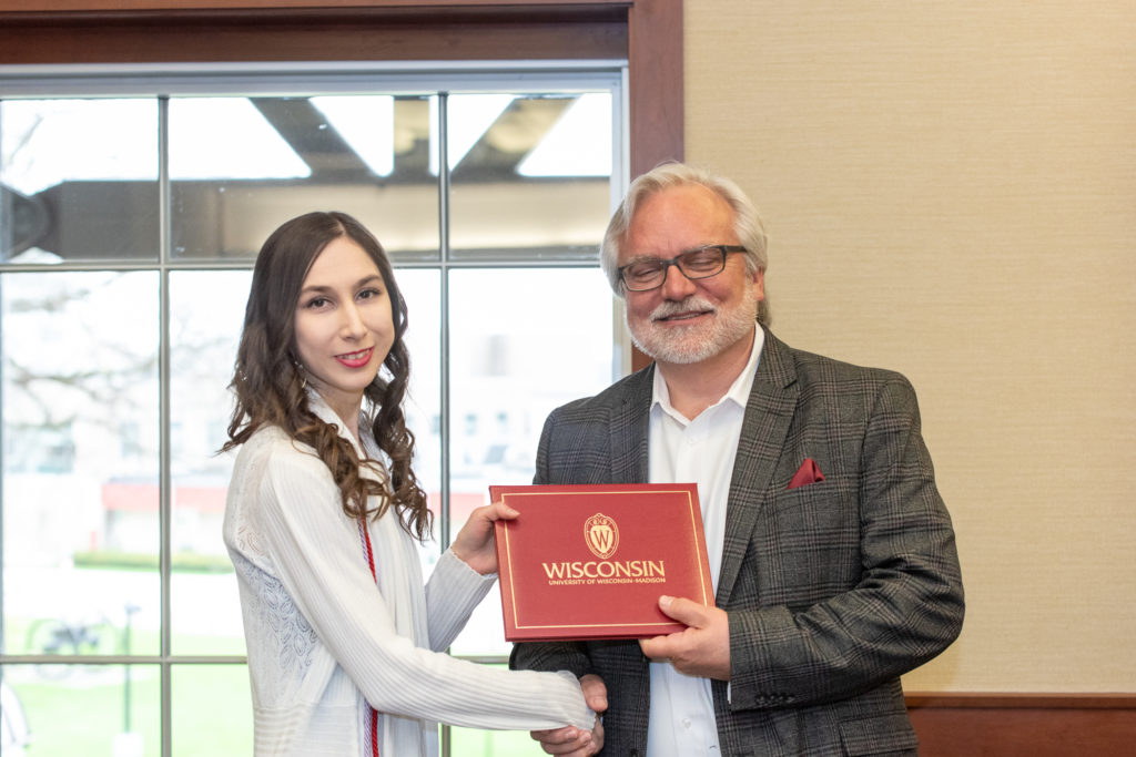 PharmToxCommence-05112019-058 Students receive their diploma from Professor Jeff Johnson.