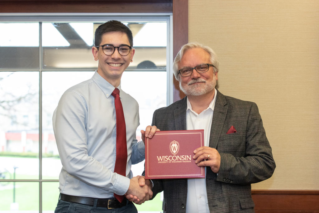 PharmToxCommence-05112019-059 Students receive their diploma from Professor Jeff Johnson.