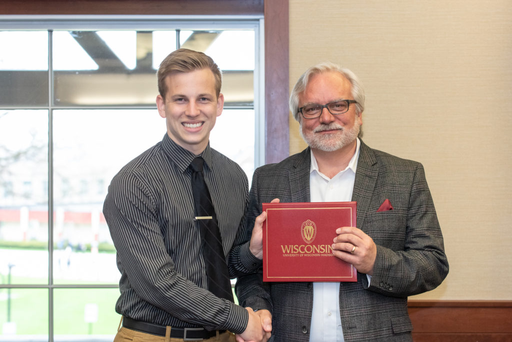 PharmToxCommence-05112019-061 Students receive their diploma from Professor Jeff Johnson.