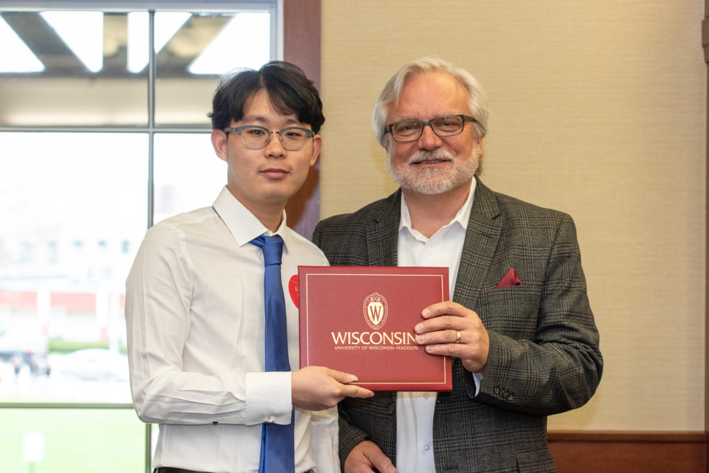 PharmToxCommence-05112019-062 Students receive their diploma from Professor Jeff Johnson.