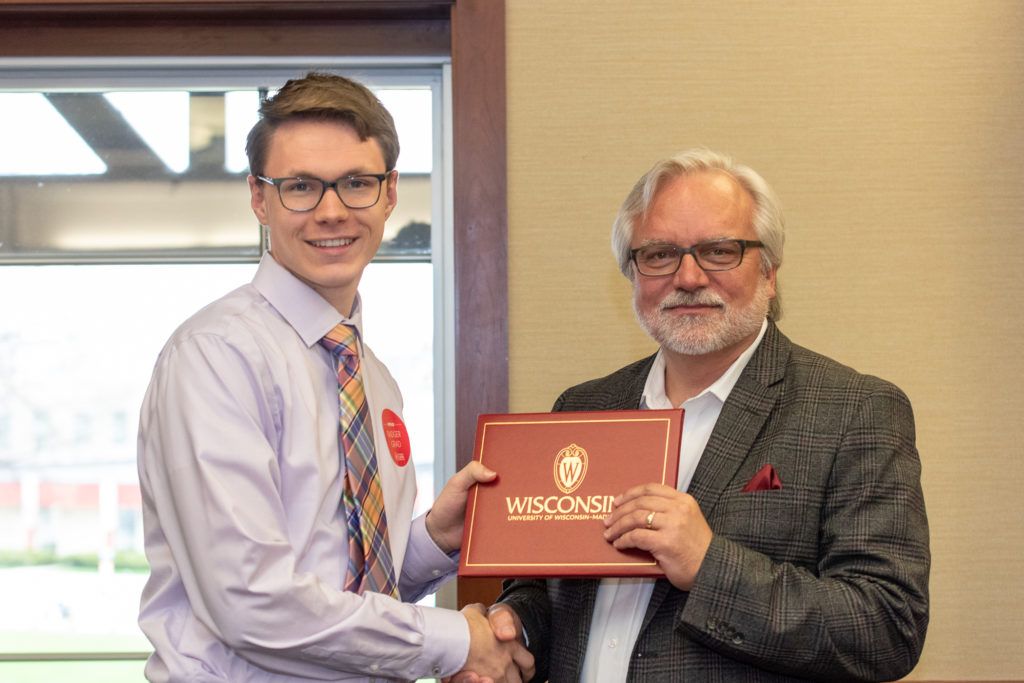 PharmToxCommence-05112019-067 Students receive their diploma from Professor Jeff Johnson.