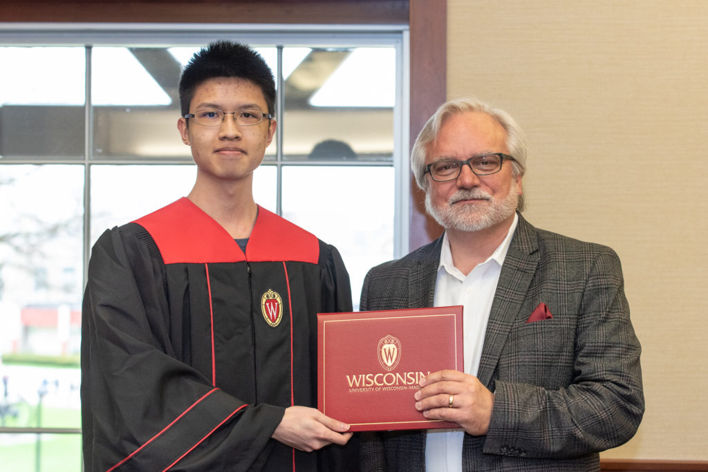 PharmToxCommence-05112019-069 Students receive their diploma from Professor Jeff Johnson.