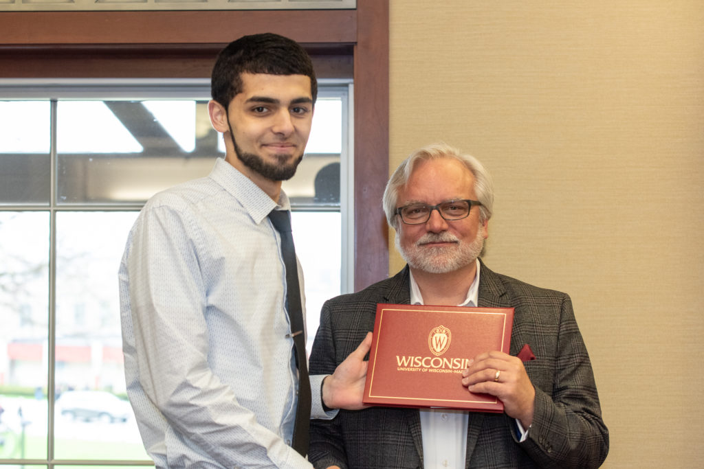 PharmToxCommence-05112019-070 Students receive their diploma from Professor Jeff Johnson.