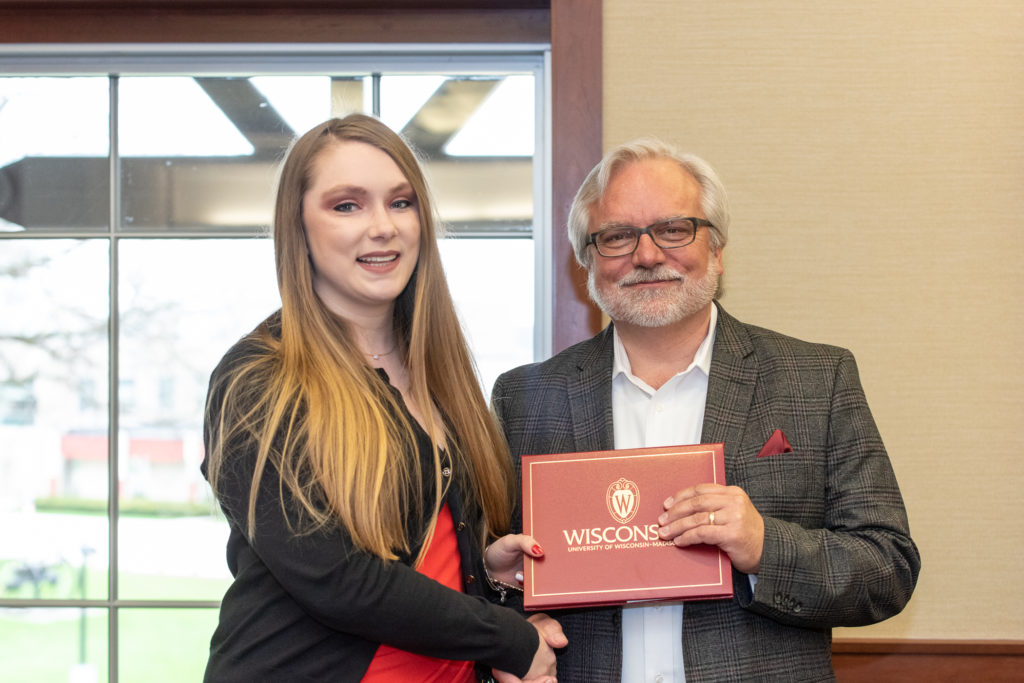 PharmToxCommence-05112019-071 Students receive their diploma from Professor Jeff Johnson.