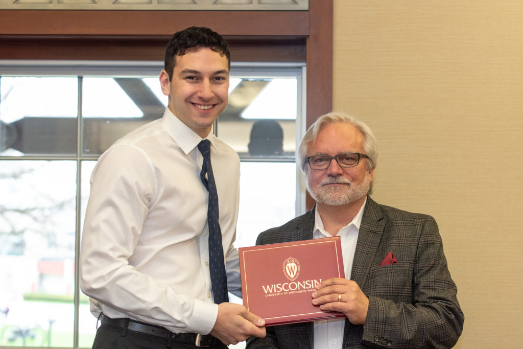 PharmToxCommence-05112019-072 Students receive their diploma from Professor Jeff Johnson.