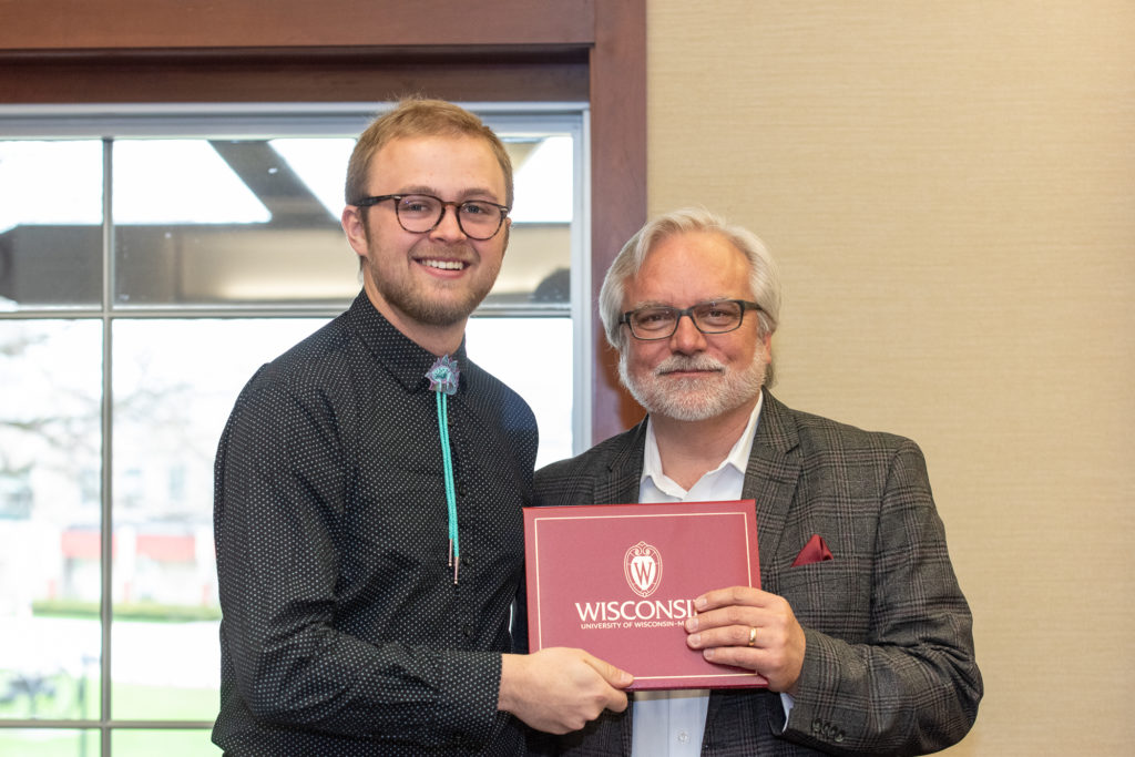 PharmToxCommence-05112019-075 Students receive their diploma from Professor Jeff Johnson.