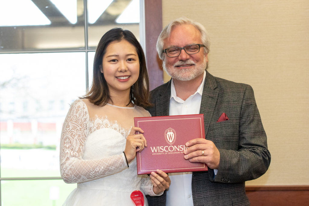 PharmToxCommence-05112019-078 Students receive their diploma from Professor Jeff Johnson.