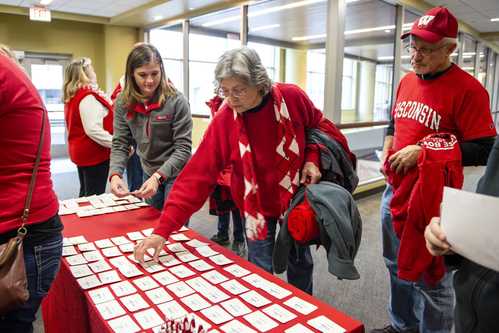 PharmacyAlumniTailgateEvent_1018_DSC3296 Alumni checking into the UW-Madison Pharmacy Alumni Tailgate event, held at Union South during the Badgers vs. Cornhuskers game.