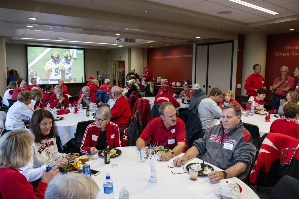 PharmacyAlumniTailgateEvent_1018_DSC3332 Alumni enjoying a meal at the start of the UW-Madison Pharmacy Alumni Tailgate event, held at Union South during the Badgers vs. Cornhuskers game.