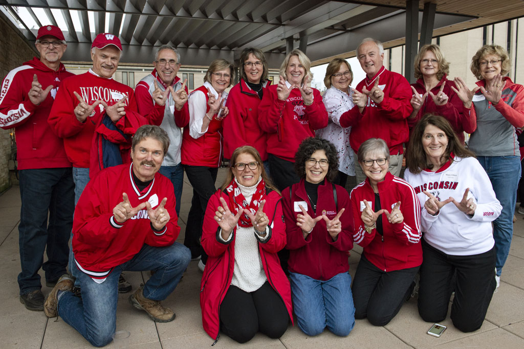 PharmacyAlumniTailgateEvent_1018_DSC3446 The Class of 1978 holding up the "W" for Wisconsin at the UW-Madison Pharmacy Alumni Tailgate event, held at Union South during the Badgers vs. Cornhuskers game.