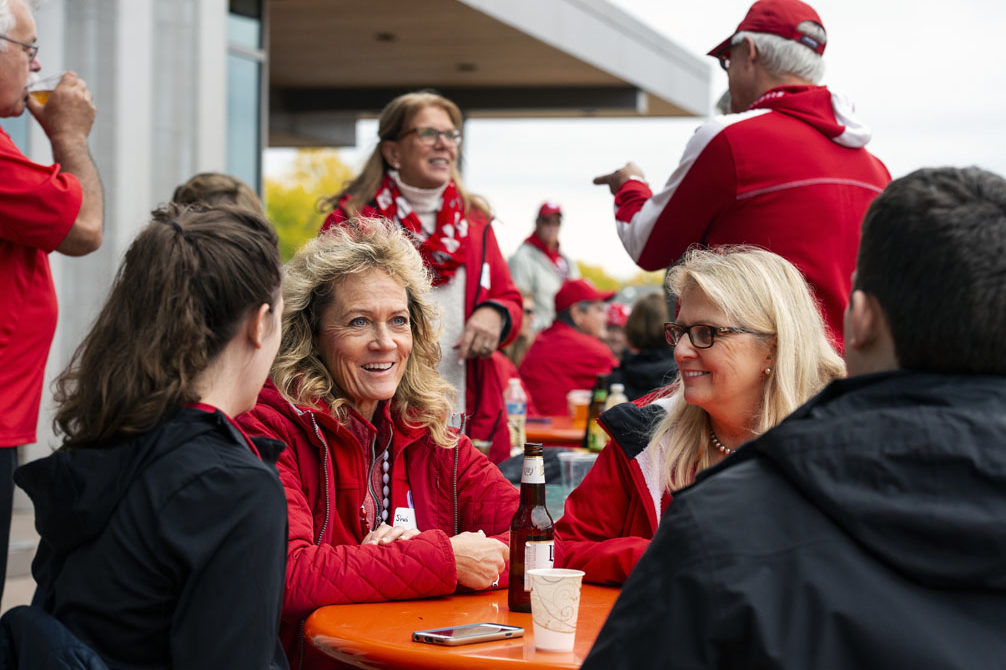 PharmacyAlumniTailgateEvent_1018_DSC_6381 Alumni catching up at the UW-Madison Pharmacy Alumni Tailgate event, held at Union South during the Badgers vs. Cornhuskers game.