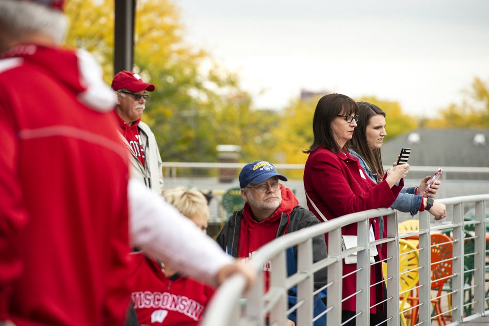 PharmacyAlumniTailgateEvent_1018_DSC_6393 Alumni watching the Badger Band perform at the UW-Madison Pharmacy Alumni Tailgate event, held at Union South during the Badgers vs. Cornhuskers game.