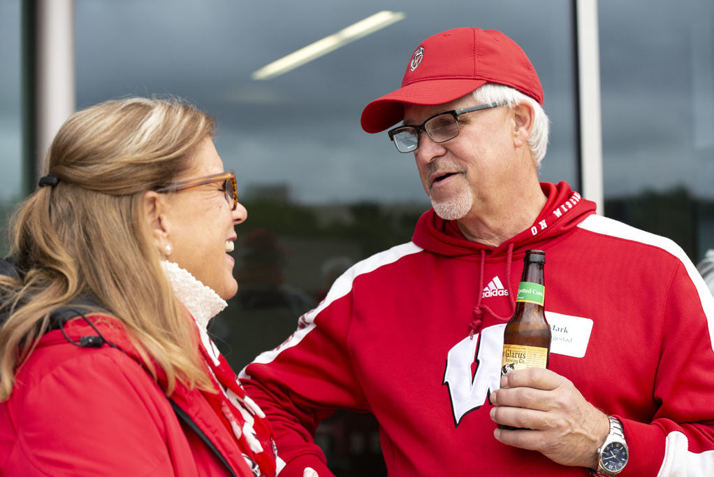 PharmacyAlumniTailgateEvent_1018_DSC_6456 Alumni catching up at the UW-Madison Pharmacy Alumni Tailgate event, held at Union South during the Badgers vs. Cornhuskers game.
