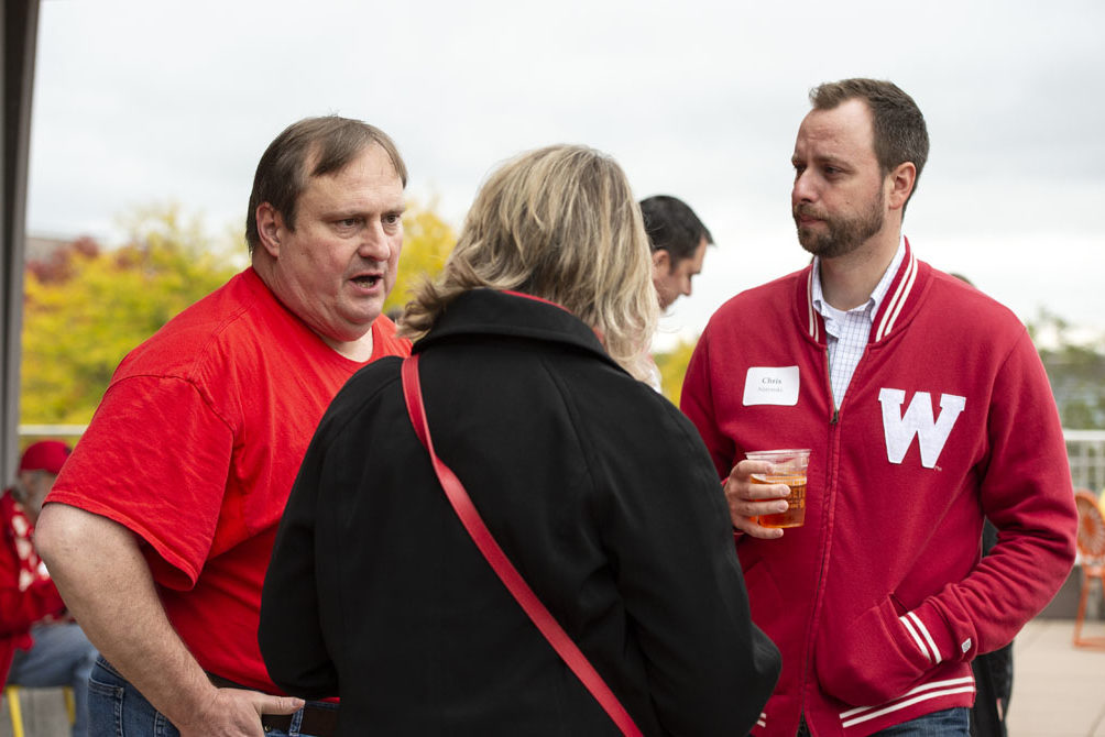 PharmacyAlumniTailgateEvent_1018_DSC_6605 Alumni catching up at the UW-Madison Pharmacy Alumni Tailgate event, held at Union South during the Badgers vs. Cornhuskers game.