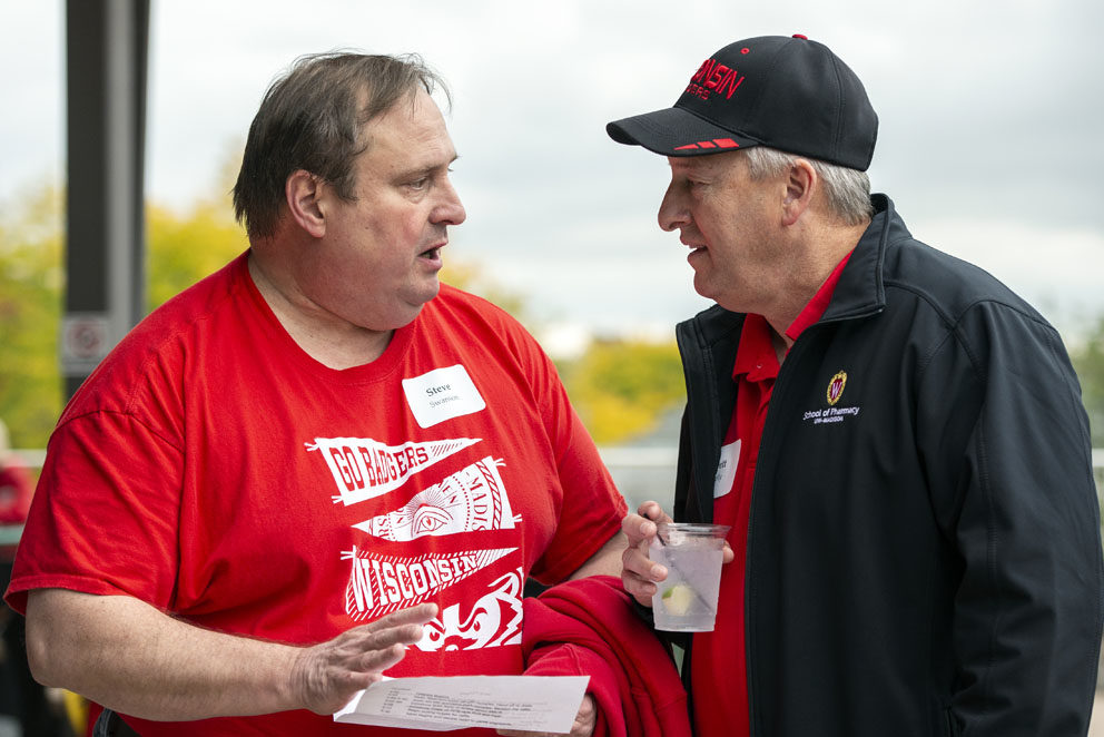 PharmacyAlumniTailgateEvent_1018_DSC_6750 Alumni catching up at the UW-Madison Pharmacy Alumni Tailgate event, held at Union South during the Badgers vs. Cornhuskers game.