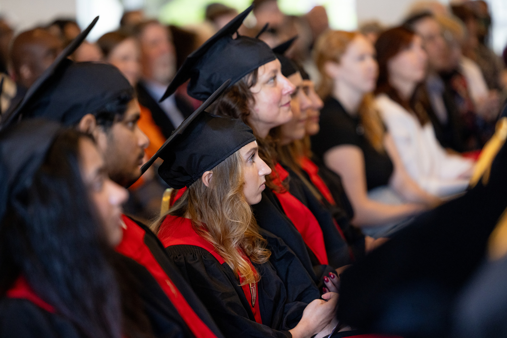 Pharmacy_Graduation_2024_018 Graduates listen to speakers
