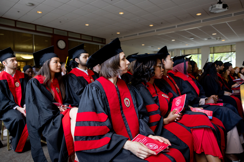 Pharmacy_Graduation_2024_022 Graduates listen to speakers