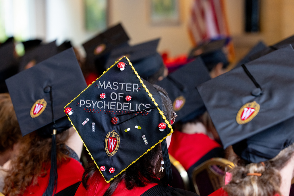 Pharmacy_Graduation_2024_030 Graduation hats, one bearing the words "Master of Psychedelics"