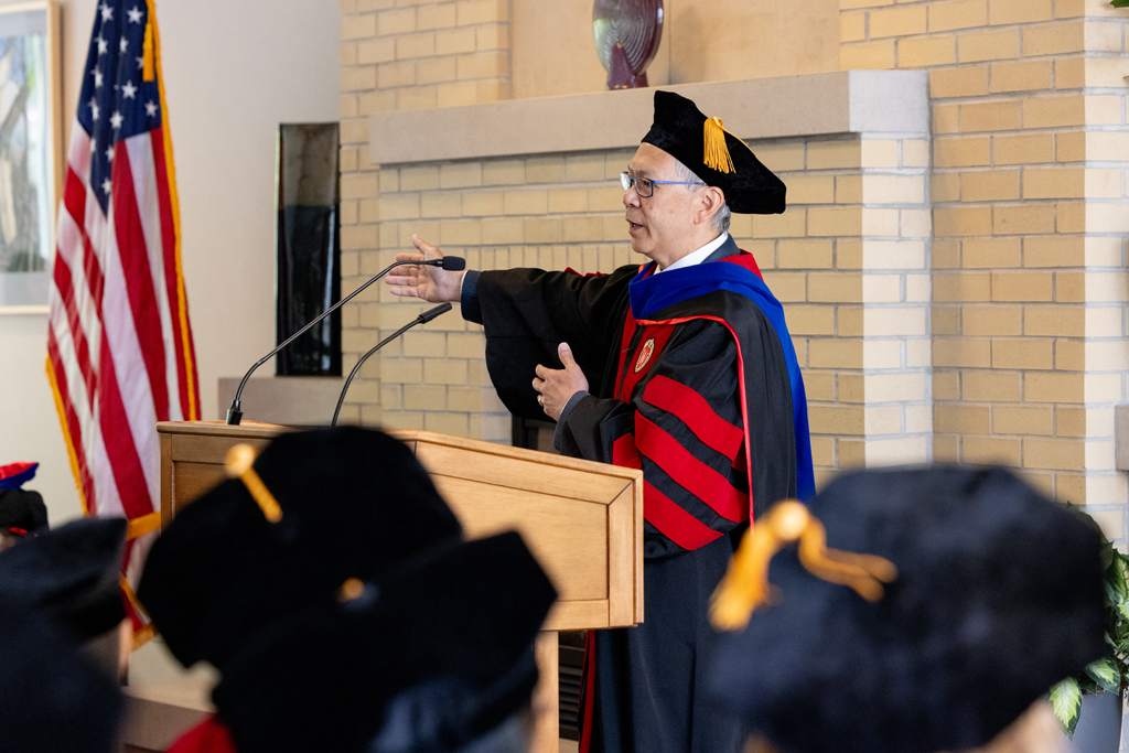 Pharmacy_Graduation_2024_035 Roger Tung speaks at the podium
